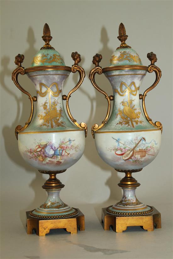 A pair of Sevres style porcelain and ormolu mounted vases and covers, late 19th / early 20th century, 31cm, one cover chipped